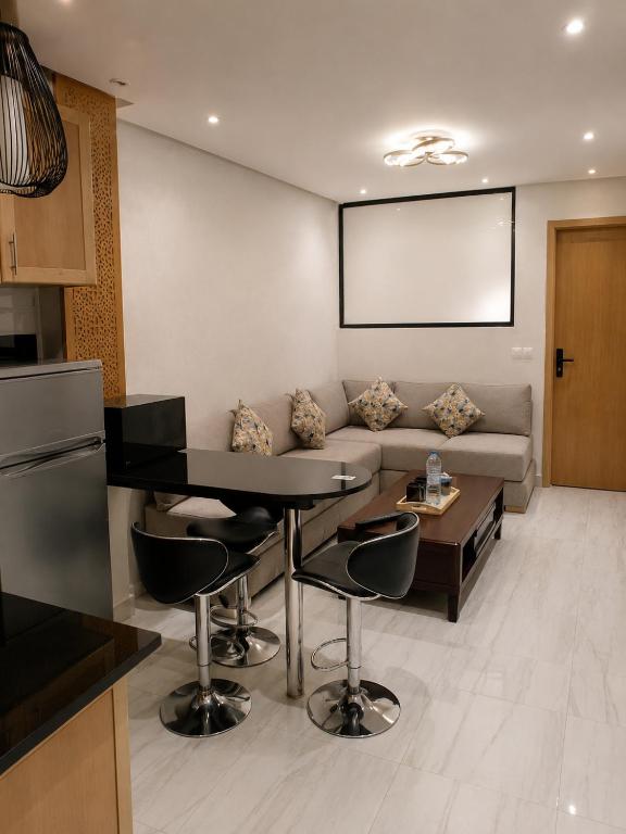 a living room with a couch and a table at Modern Studio Hassan Rabat in Rabat