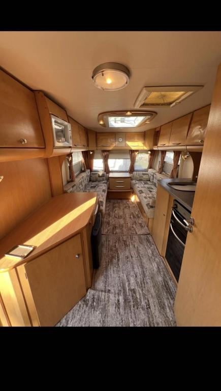 an interior view of an rv with a kitchen and a living room at Кемпер дом in Chişinău