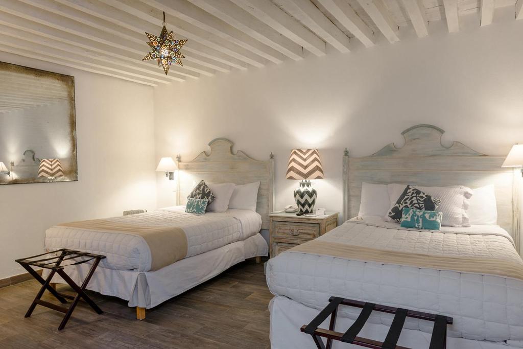 Postel nebo postele na pokoji v ubytování Hotel La Morada