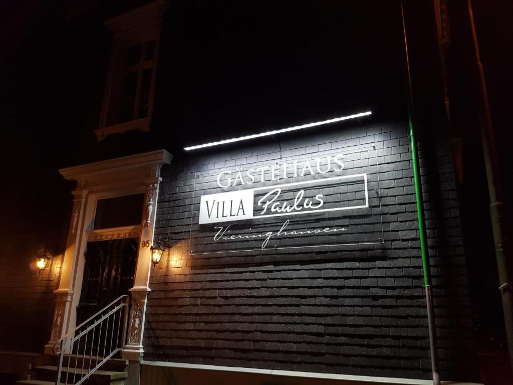 a sign on the side of a building at night at Hotel 1782 "Außenstelle" Premiumwohnungen - Contactless self check-in in Remscheid