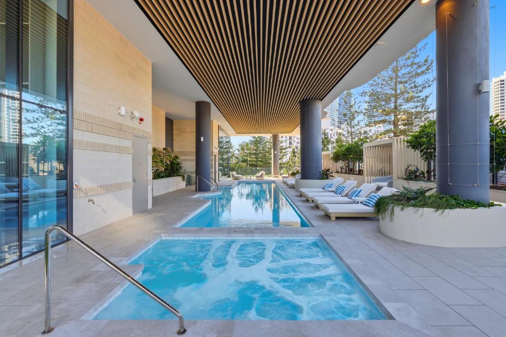 a swimming pool in the middle of a building at Amaya in Gold Coast