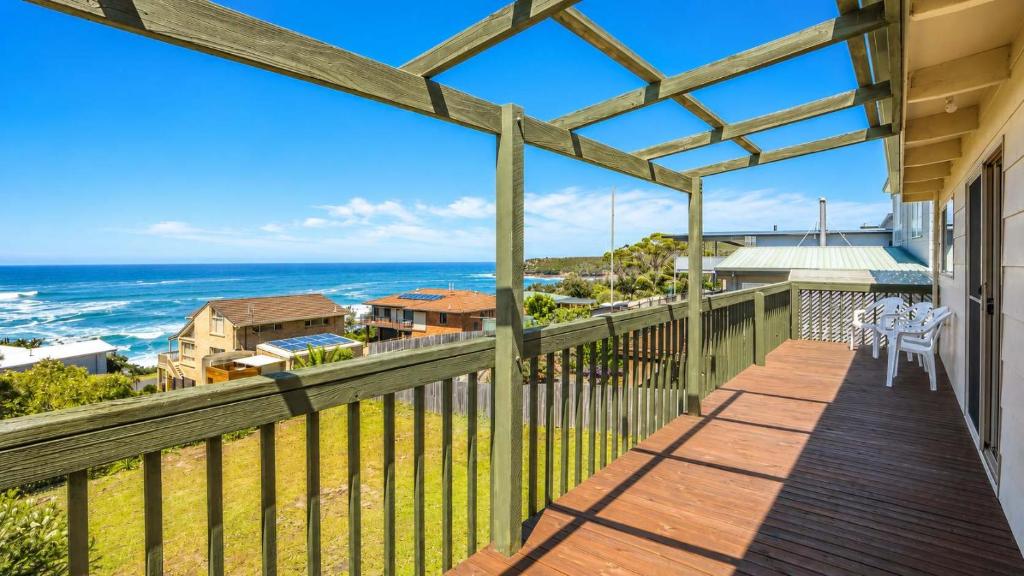 a balcony with a view of the ocean at Summer House On Kurrawa - stunning beach views in Kioloa