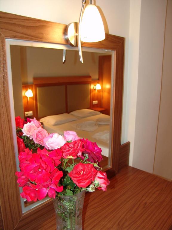 Postel nebo postele na pokoji v ubytování Hermes Hotel