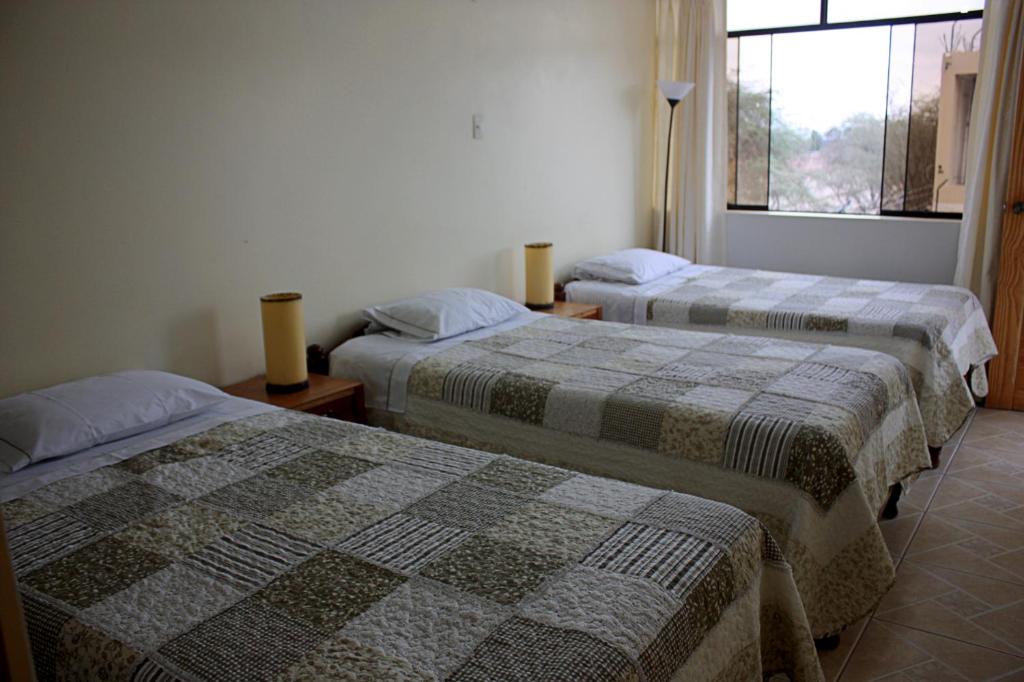 Postel nebo postele na pokoji v ubytování Hospedaje Dulce Estancia