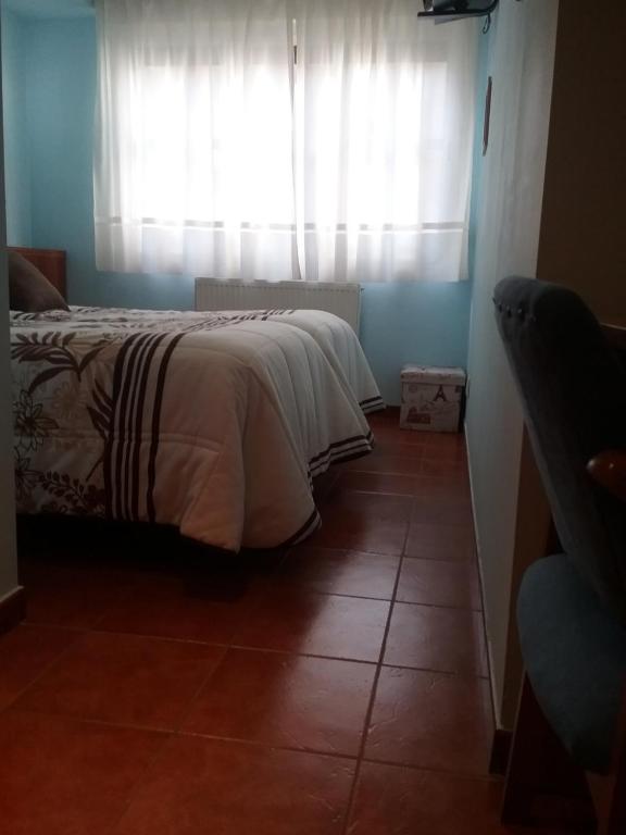 Posteľ alebo postele v izbe v ubytovaní Hostal Campus