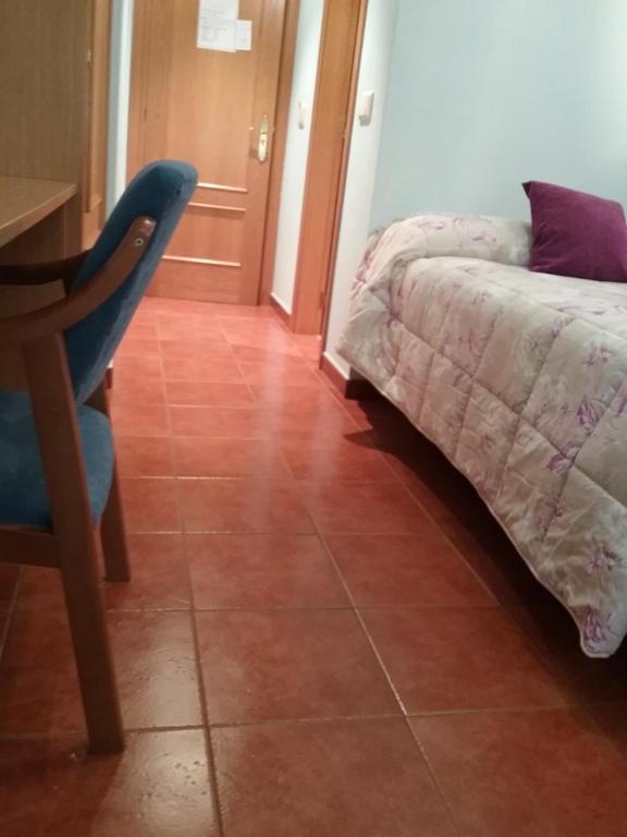 Posteľ alebo postele v izbe v ubytovaní Hostal Campus
