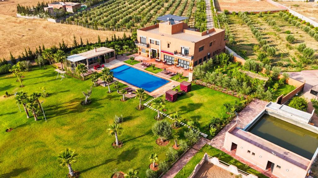 an aerial view of a house with a swimming pool at Igrane House - Resort & Spa in Aït Faska
