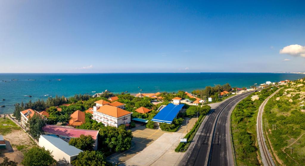 an aerial view of a small town next to the ocean at Phu Yen Beachfront Fishing Village Homestay in Tuy Hoa