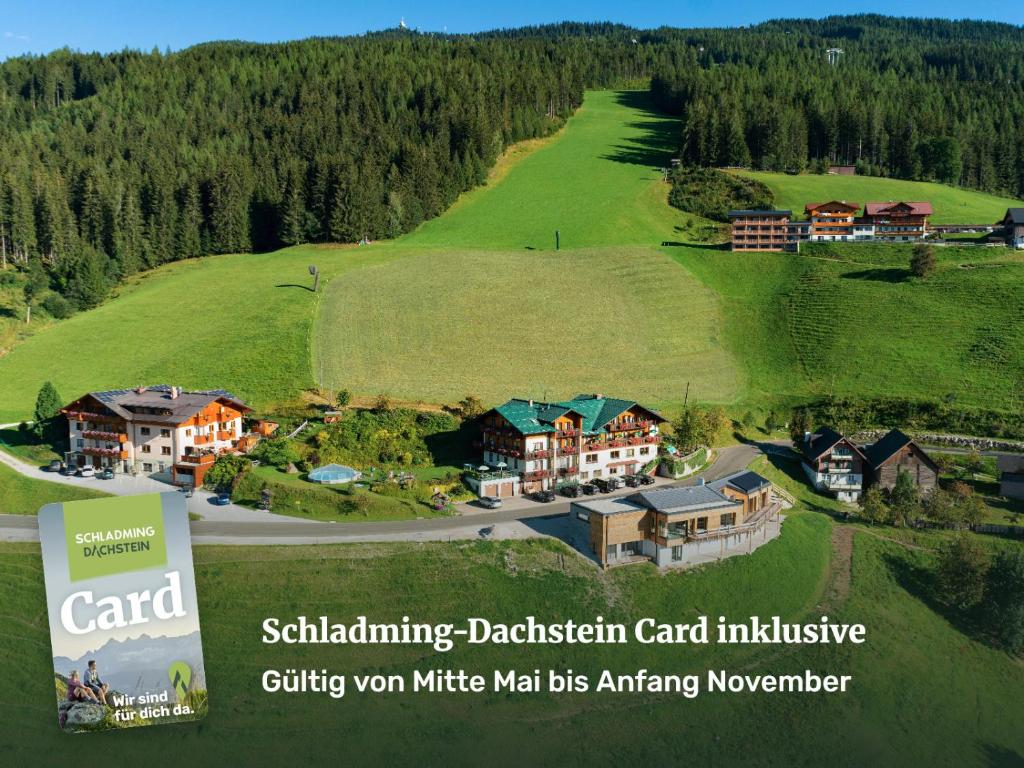 arial view of a residential estate on a green hill at Posers Bergwelt B&B in Schladming
