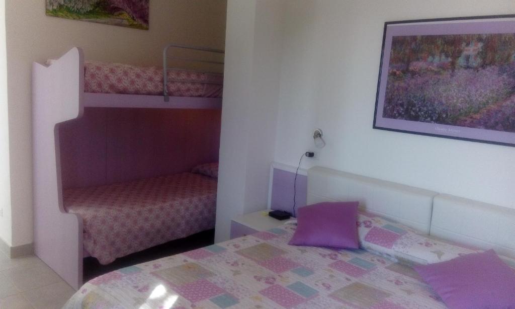 Кровать или кровати в номере I Lecci Di Soviore