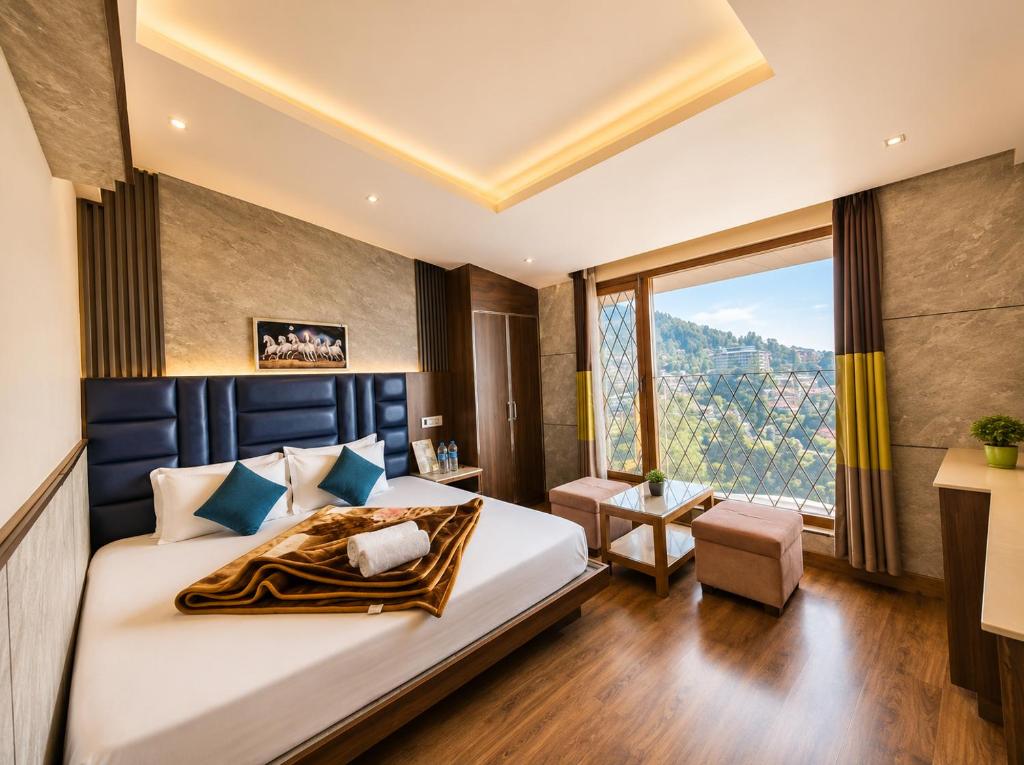 a bedroom with a large bed and a large window at The Town Boho in Shimla