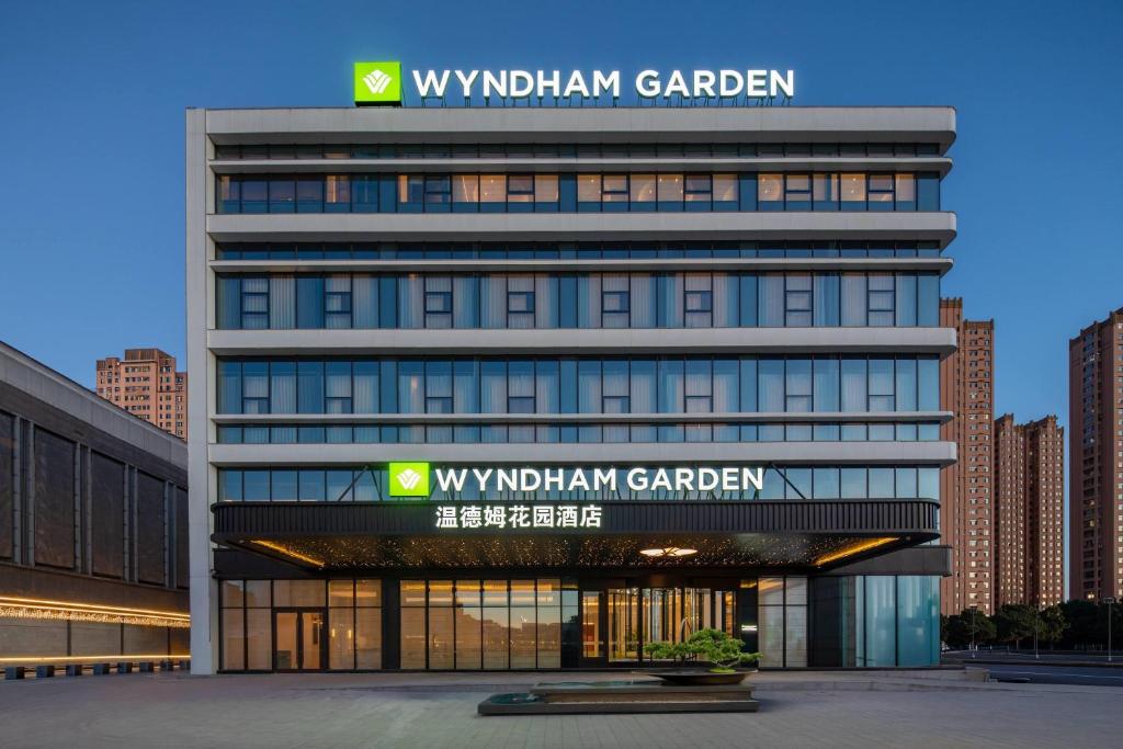 a building with a sign that reads waughan garden at Wyndham Garden Datong Ancient City in Datong