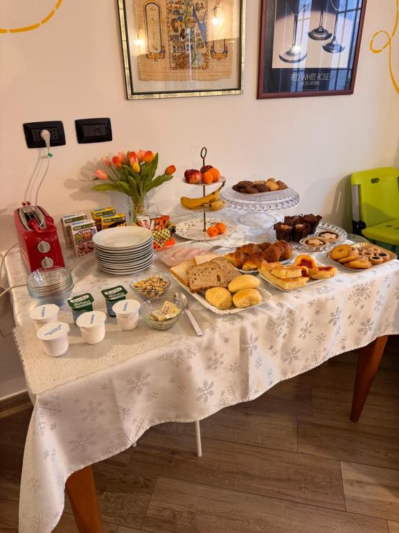 a table with a bunch of different types of food at La Corte B&B in Candiolo