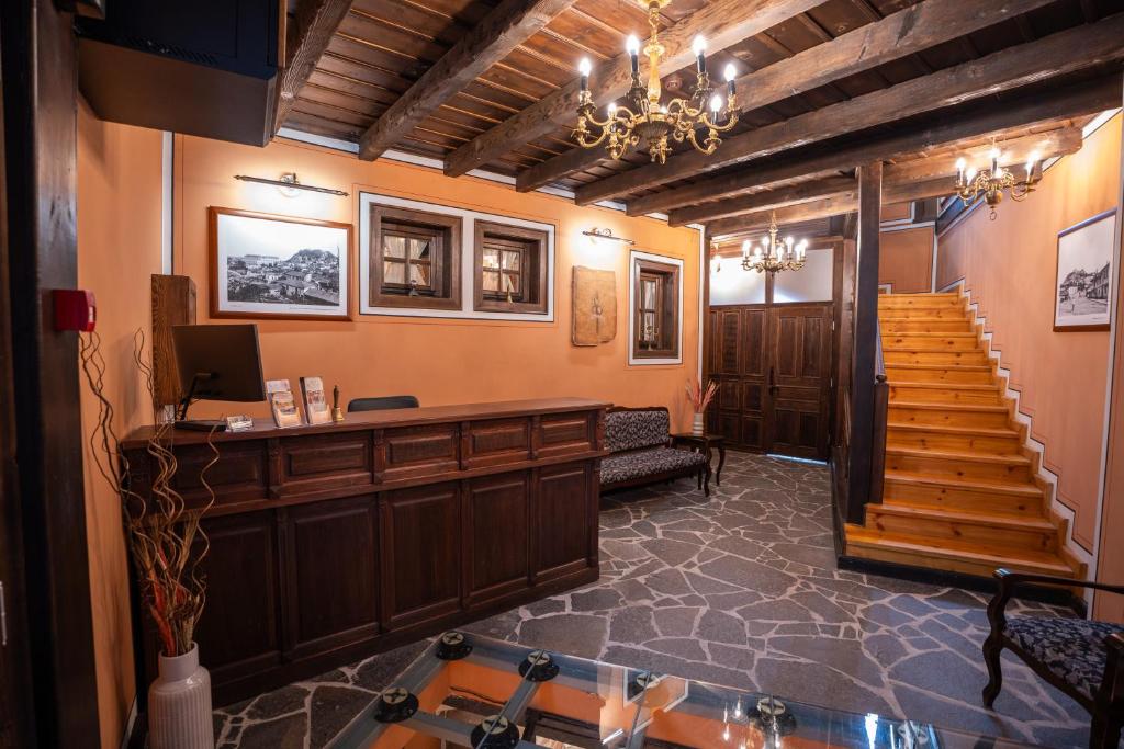 a lobby with a reception desk and stairs in a building at RAHAT Guest House in Old Town - Free Private Parking in Plovdiv