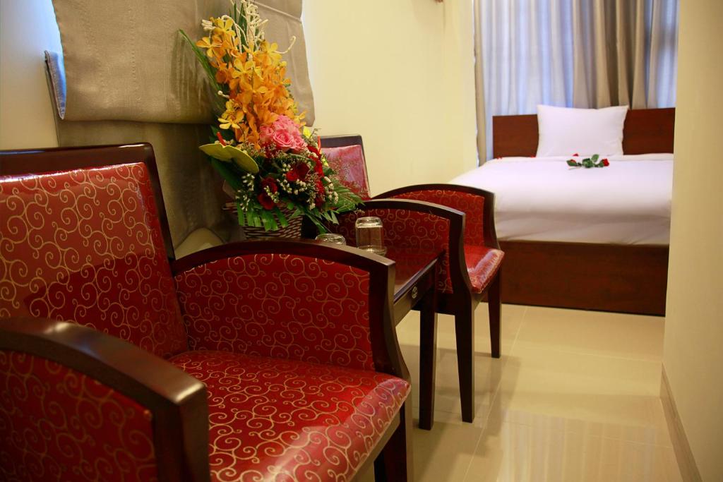 Postel nebo postele na pokoji v ubytování Danang Classic Hotel