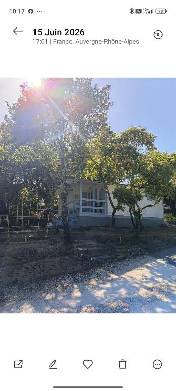two pictures of a house with trees in front of it at La cabane provençale in Chamaret
