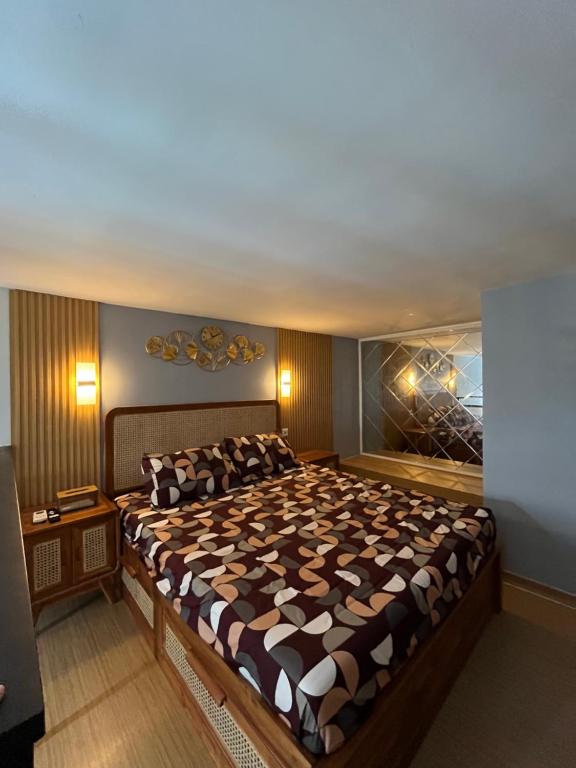 a large bedroom with a large bed in it at Halo Apartemen in Kebomas