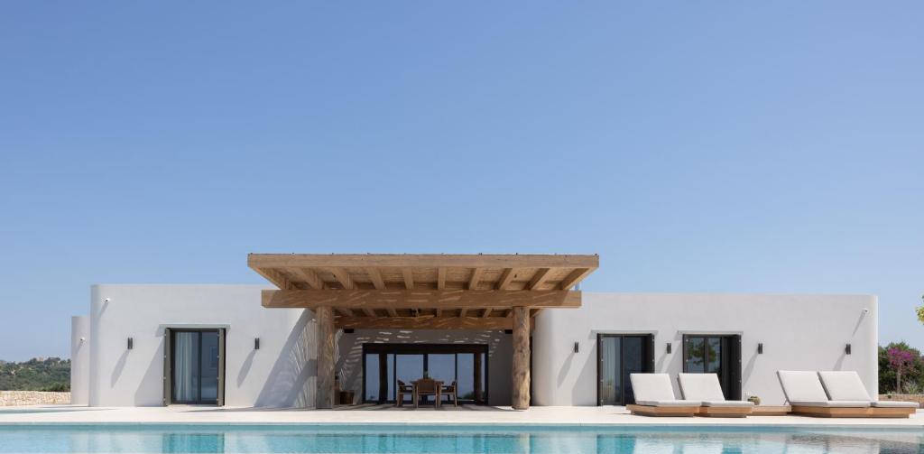 a view of a villa with a pool at Villa Kairos in Foiníki