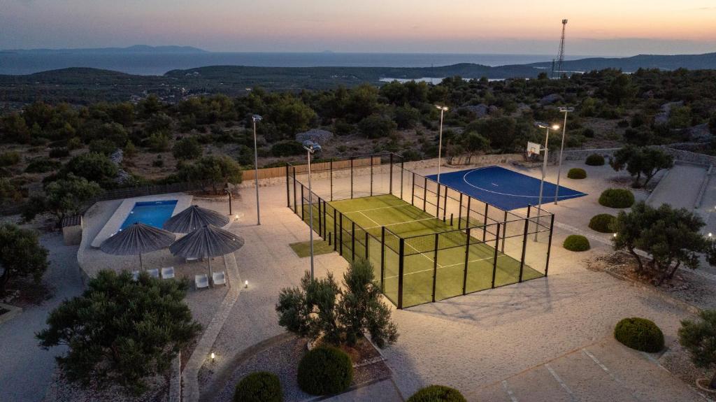 an aerial view of a tennis court with two courts at Hacienda Nikolic in Milna