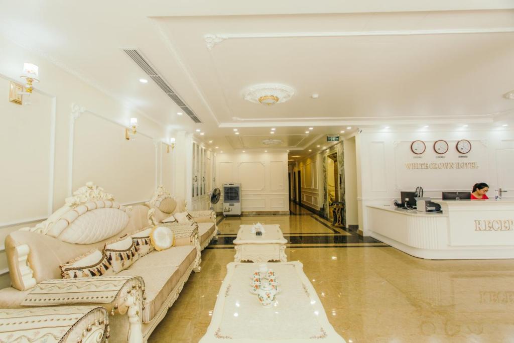 a large living room with a couch and a table at White Crown Hotel Ha Long in Ha Long