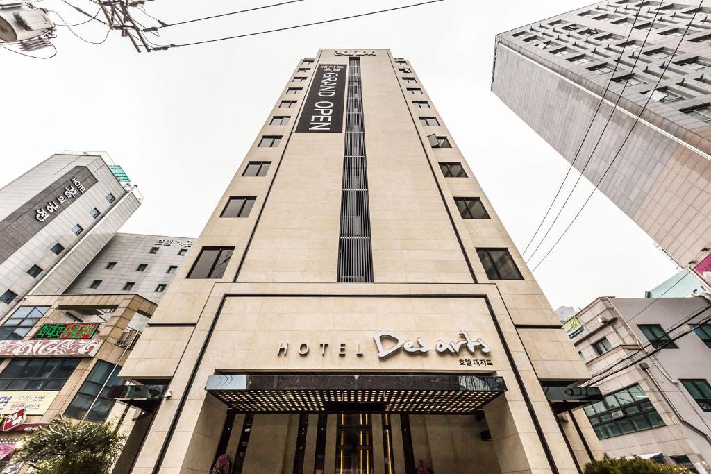 a tall building with the words hotel dejong at Desarts Hotel in Seoul