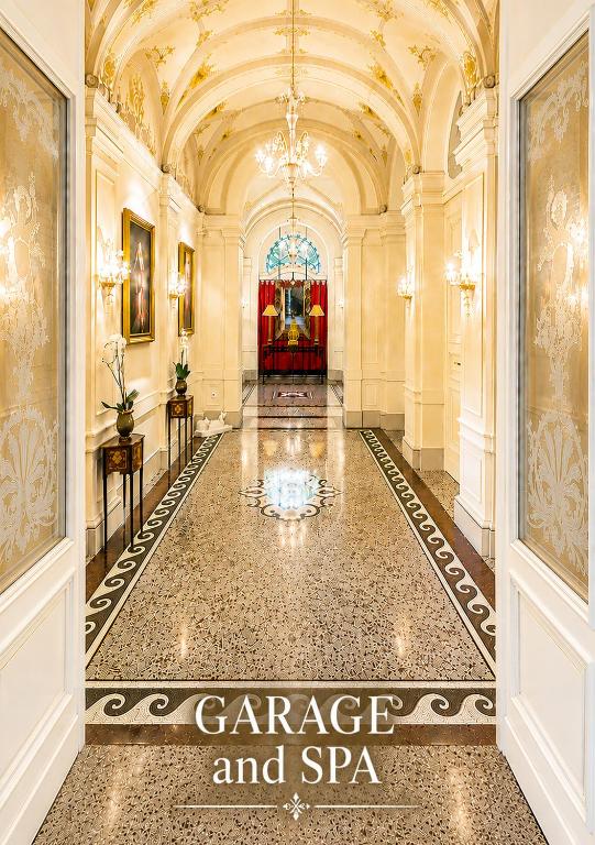 a hallway with a large room with a ceiling at Le Palais Art Hotel Prague in Prague