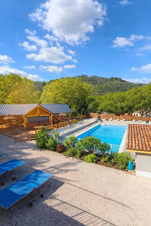 an image of a swimming pool at a resort at Camping Hôtel Maui in Tournon-sur-Rhône