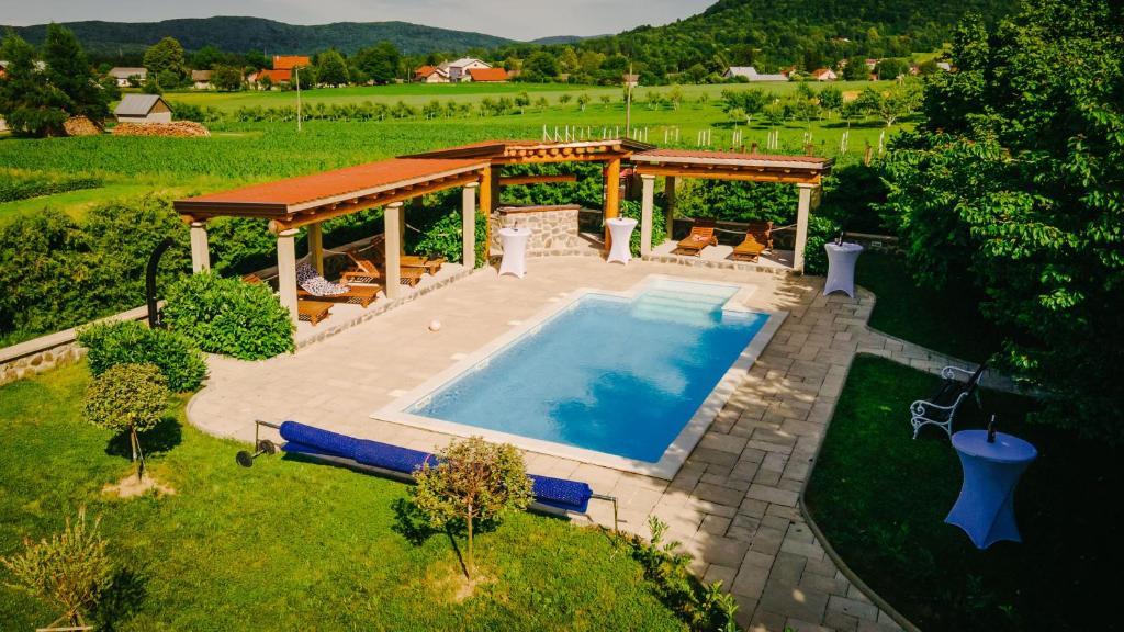 an aerial view of a swimming pool in a backyard at Lika Story in Josipdol