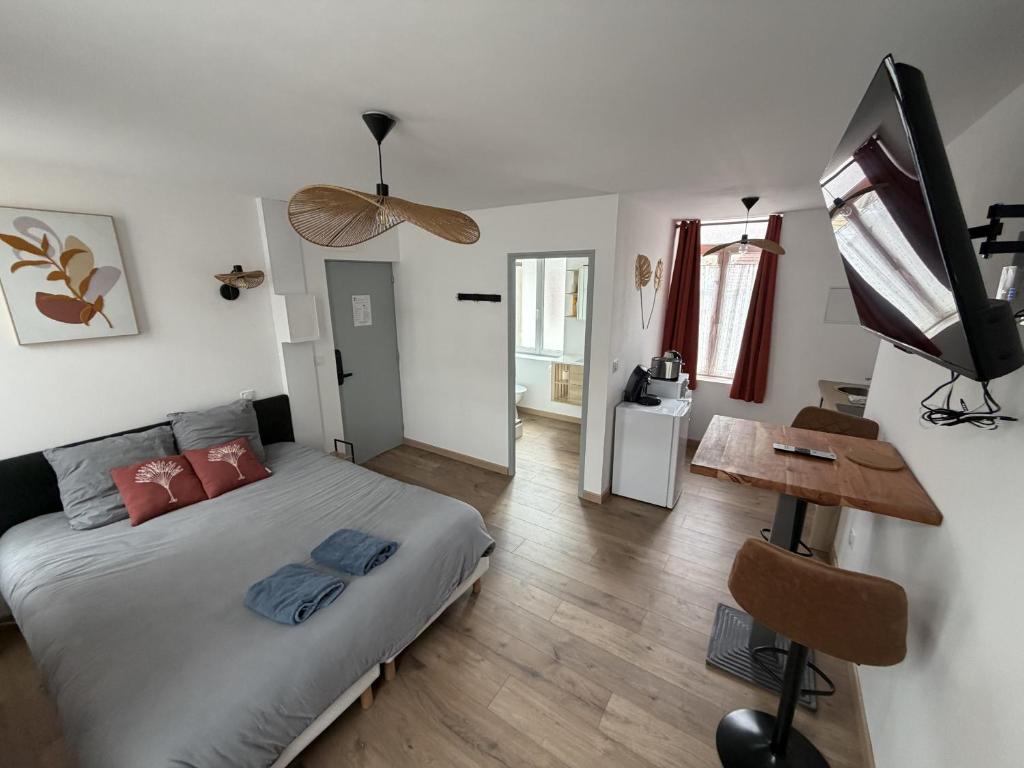 a bedroom with a bed and a desk in it at ecuires 1 in Écuires