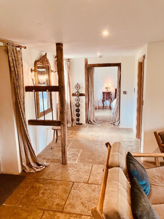 a living room with a couch and a table at Glanwye in Hay-on-Wye
