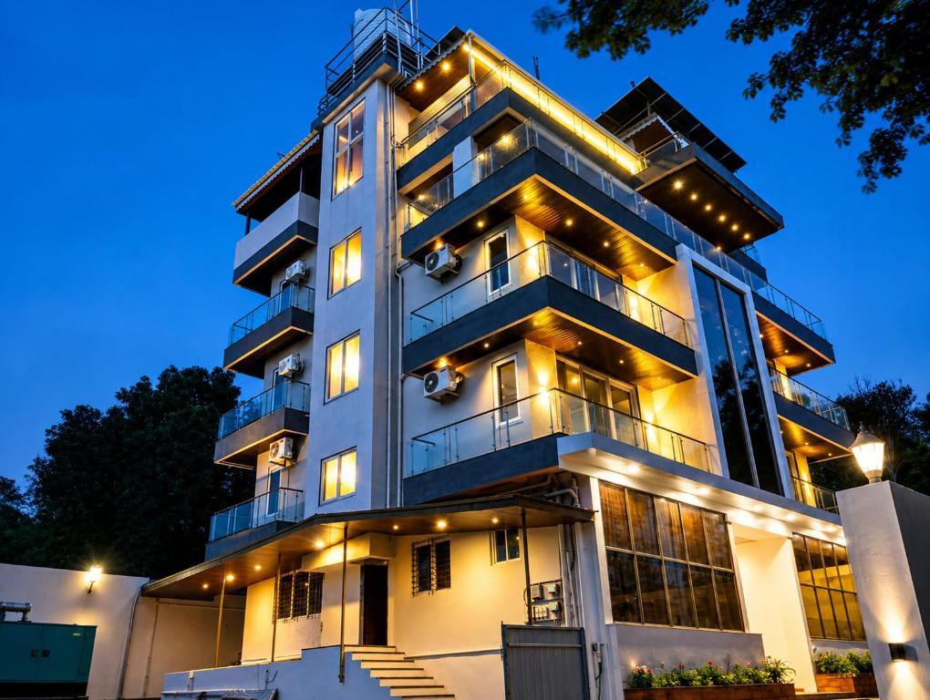 a building with lights on it at night at The Metro Hotel in Panhāla