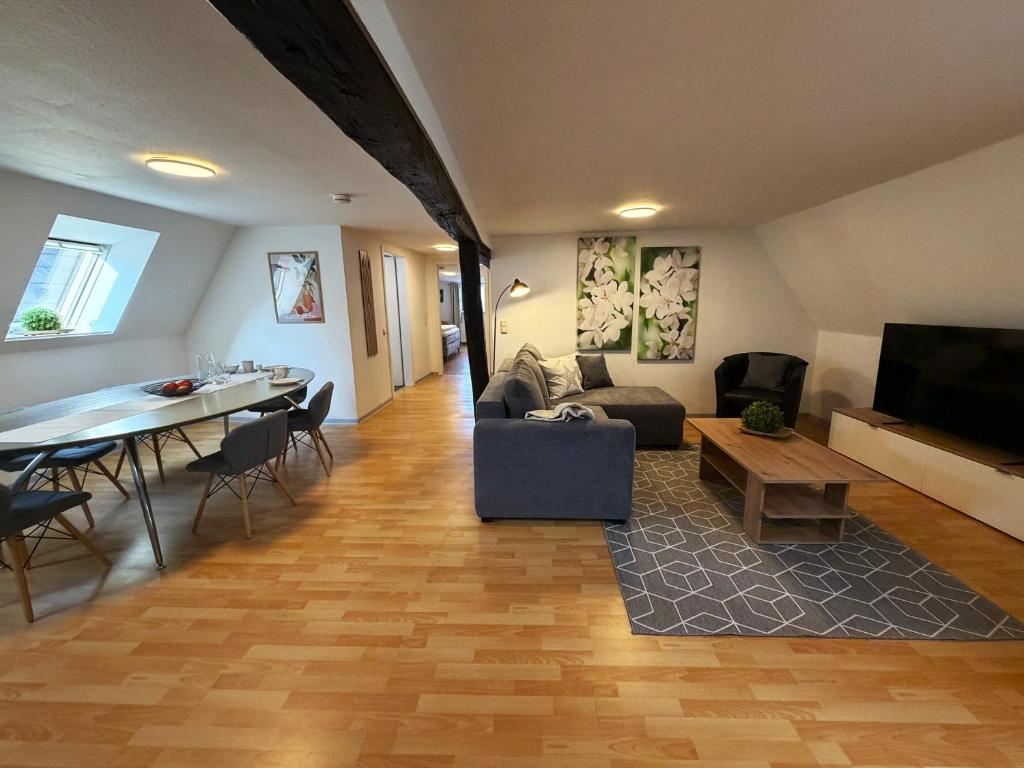 a living room with a couch and a table at Marktplatzapartment 2 in Höxter