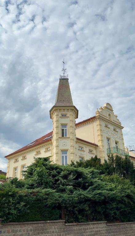 a building with a tower on top of it at Aparthotel František in Světlá nad Sázavou