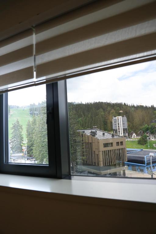 a view of a building from a window at SKYHILL 1 O1 Jahorna in Jahorina
