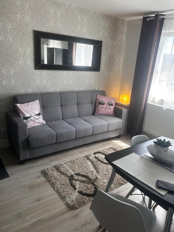 a living room with a couch and a table at DAVID Residence in Cavnic