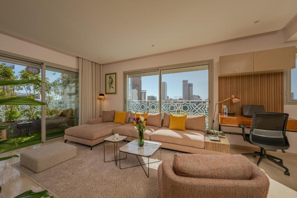 a living room with a couch and a table at anfa Louise in Casablanca