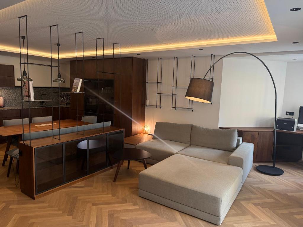 a living room with a couch and a table at Dolce Vita Appartment in Schärding