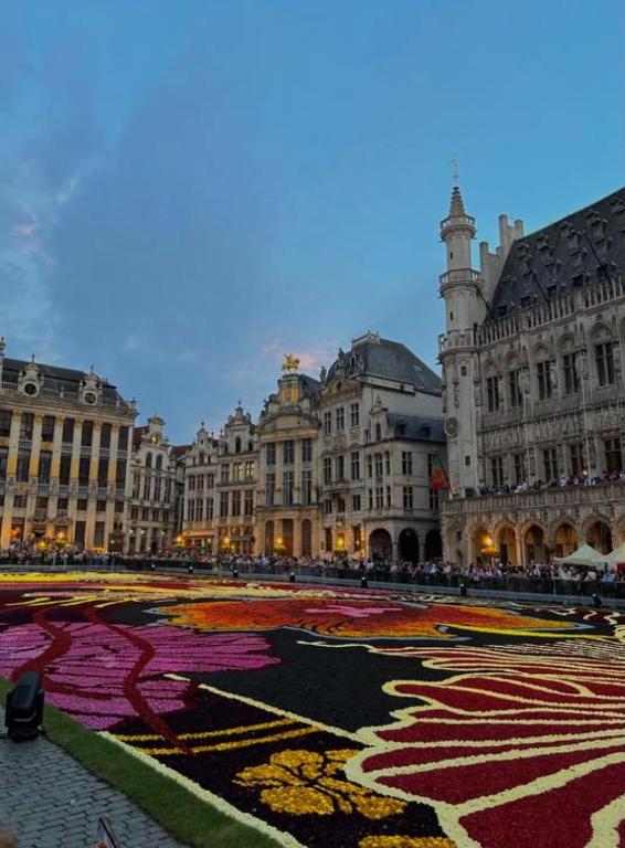 a large building with a large rug in the middle of a courtyard at Brussels Loft in Brussels