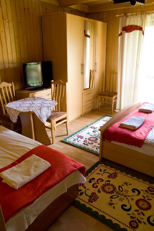 Posteľ alebo postele v izbe v ubytovaní Zakońpiańska Chata - Domek Góralski Na Kamieńcu