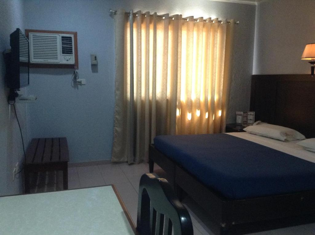 Postel nebo postele na pokoji v ubytování Miami Inn