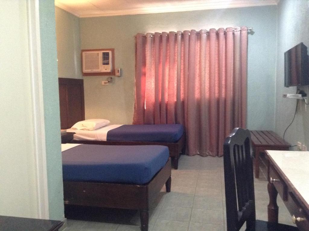 Postel nebo postele na pokoji v ubytování Miami Inn