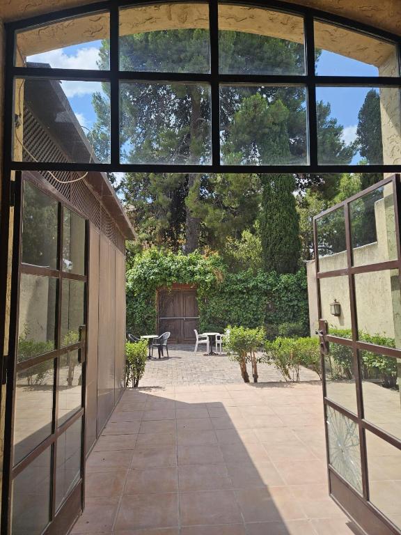 an open door to a patio with a table at Lotel Casa Noble in Valencia