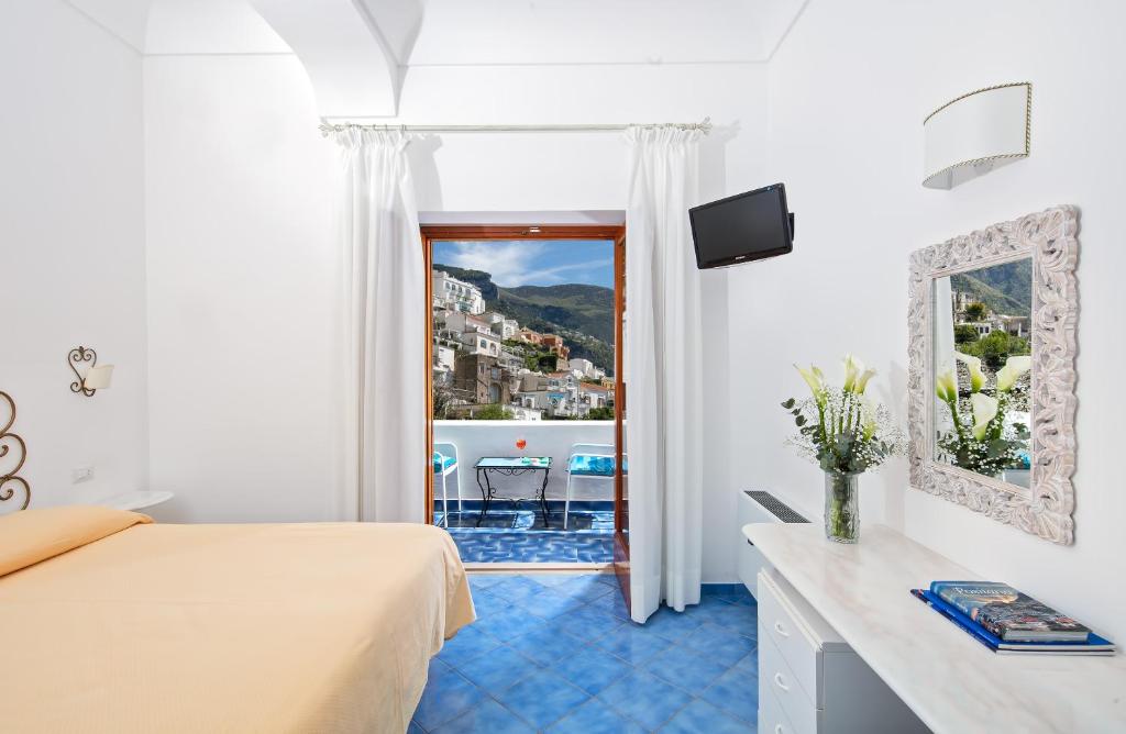 TV a/nebo společenská místnost v ubytování Hotel Vittoria