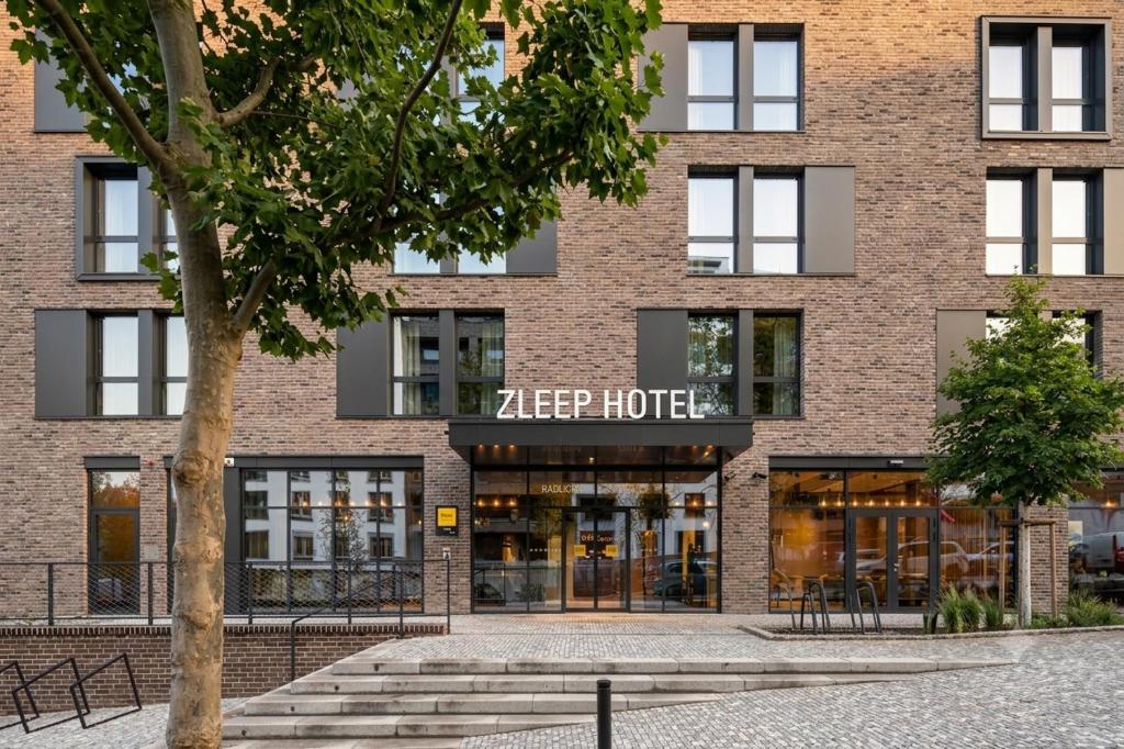 a facade of a brick building with a zep hotel at Zleep Hotel Prague in Prague
