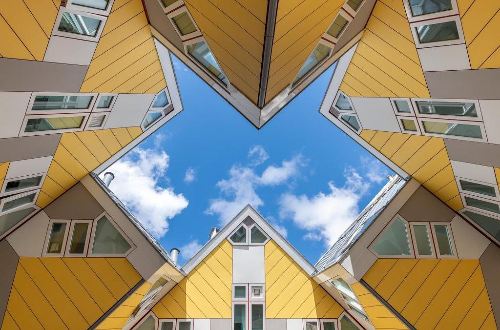 a view of the sky through the windows of a building at Stayokay Hostel Rotterdam - fully renovated April 2026 in Rotterdam