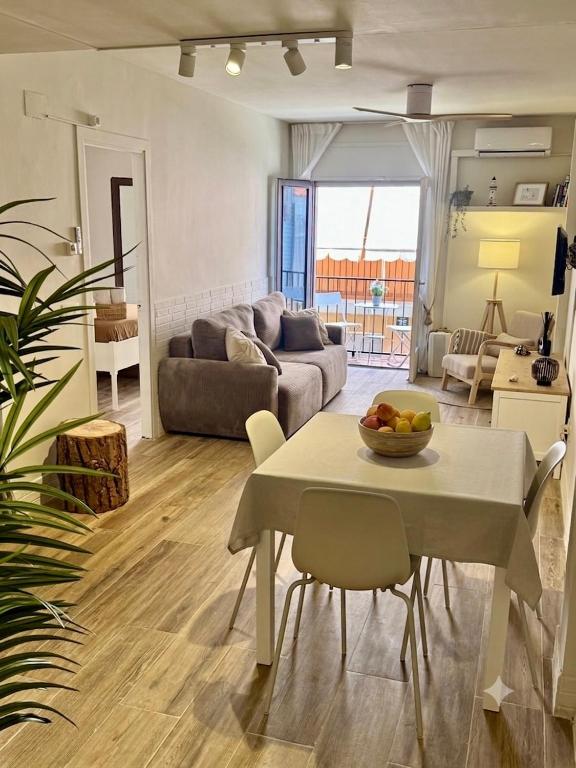 a living room with a table and a couch at Max in Tossa de Mar