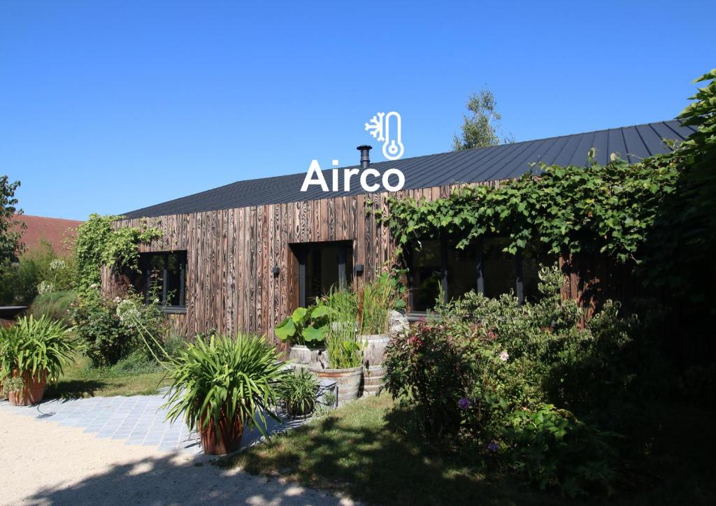 a building with an africa sign on it at Clos des Poulies in La Ferté-Saint-Aubin