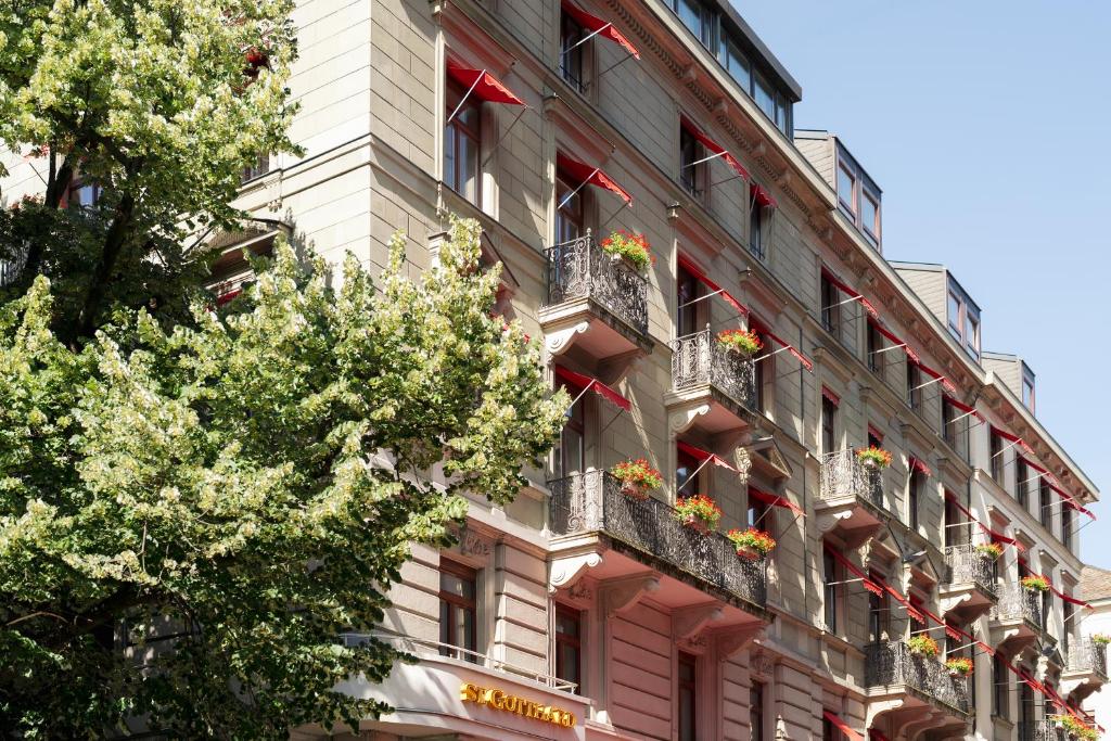 a building with flower boxes on the side of it at Hotel St.Gotthard in Zurich