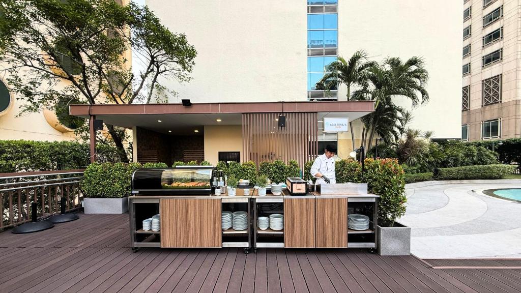 An outdoor buffet station set up beside the pool area.