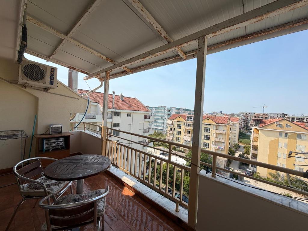 a balcony with a table and chairs and a view at Apartament Golem in Golem